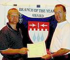 Cornu Perold branch chairman 2002 (left) receiving Branch of the Year trophy from Johan Steyn, president of the SAIMC